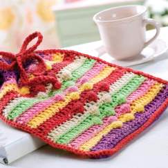 Crochet hot water bottle cosy