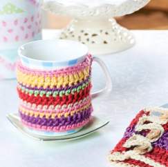Cheerful crochet teacosy, mug cosy and coasters