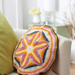 Starburst circle crochet cushion