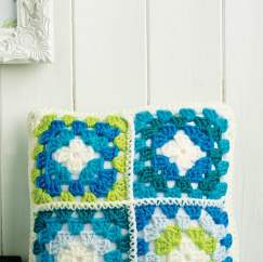 Crochet cushion with four mini granny squares