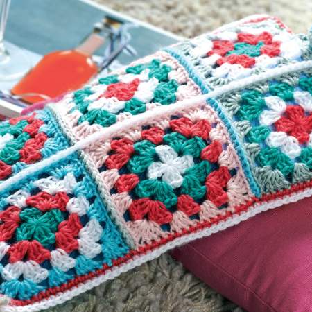 Granny square hot water bottle cosy